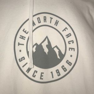 white and gray north face hoodie
